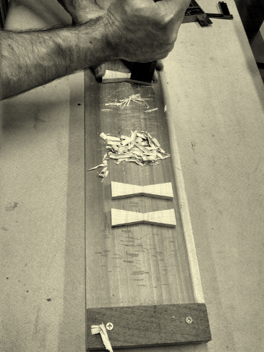 Cutting butterfly key inlays for our handmade modern wood furniture