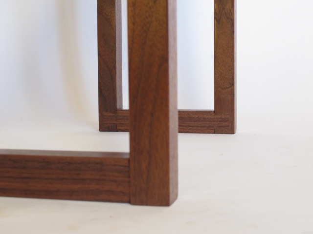 hand-cut dovetails left visible at the foot of this narrow console table- handmade wood furniture for the entryway