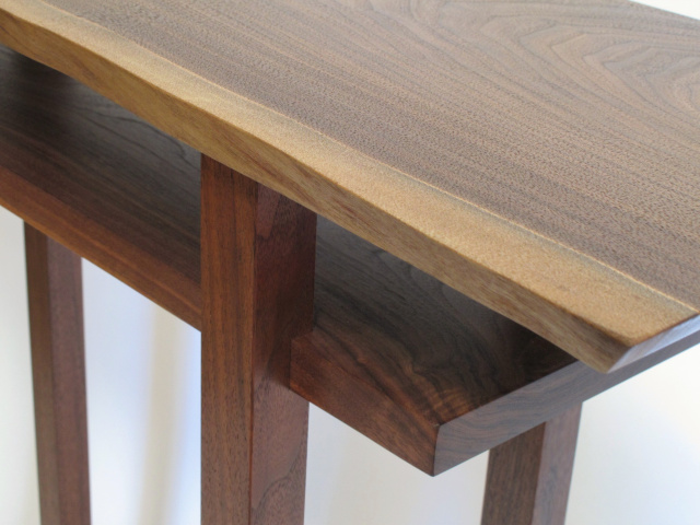 hand-cut joinery of the inset shelf and a unique grain pattern detail at the shelf corner
