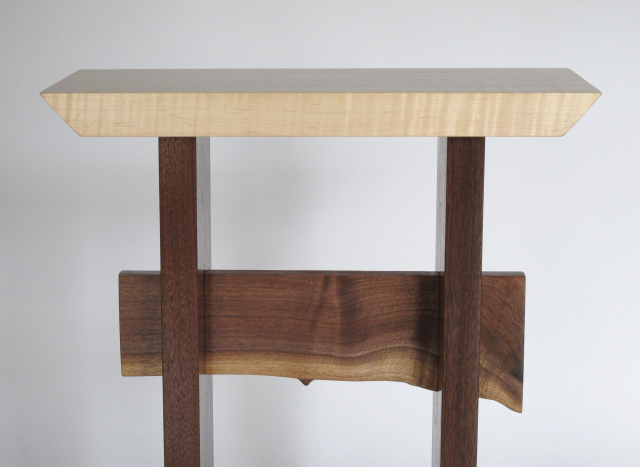A live edge table stretcher adds a touch of nature to your interior designs- pictured here on our Statement Accent Table in tiger maple and walnut
