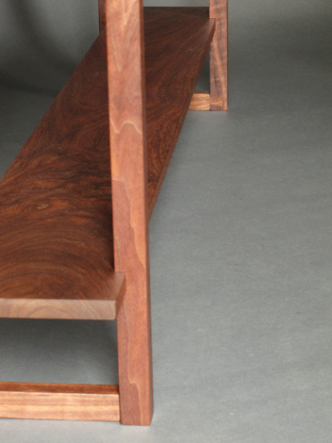 hand-cut joinery details of the dovetail feet on our long narrow console table with two shelves