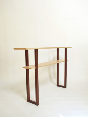 A narrow console table handmade from tiger maple and walnut- the lowered shelf provides a place for display and the narrow table size works well behind the sofa, in the hallway or entryway too