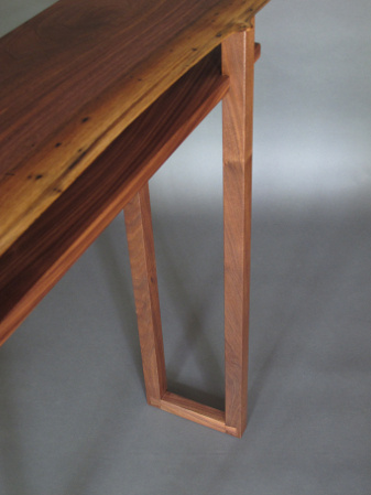 Our Live Edge Hall Table features hand-cut dovetail feet