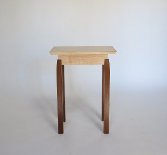 Pictured in tiger maple with walnut legs, this end table with contrasting wood colors is hand-crafted with attention to detail