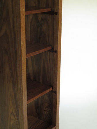 Hand-cut dovetails act as shelf supports in our tall narrow open cabinet but the visible dovetails also show off the fine craftsmanship of our furniture