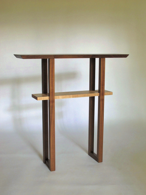 A narrow entry table handmade from walnut and tiger maple- for narrow hallways or small entryways