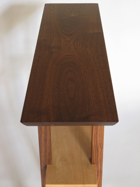 This walnut table top is a rich brown color and features beautiful wood grain patterns