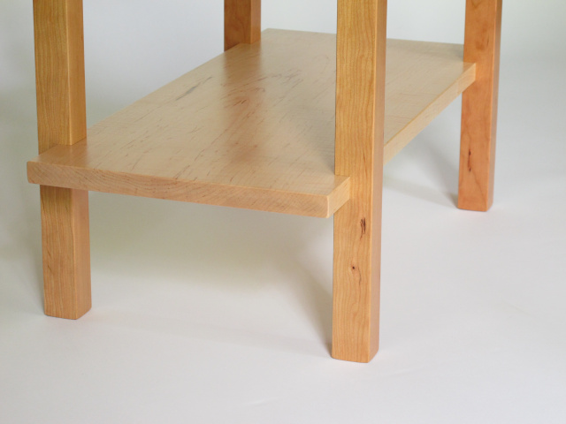 Our signature visible joinery is showcased in the hand-cut connections of the inset shelf on this small wooden bench. Handmade in the USA by Mokuzai Furniture