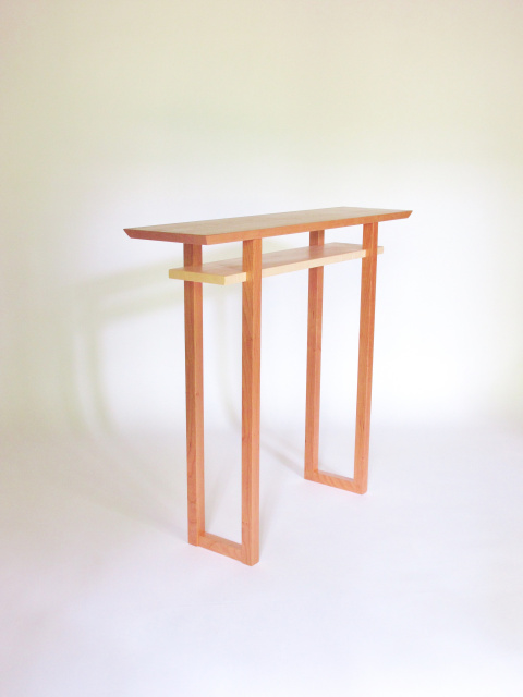 Minimalist narrow wood hall table created in solid cherry with a highlight of color in the contrasting tiger maple shelf- modern wood furniture handmade in the USA by Mokuzai Furniture