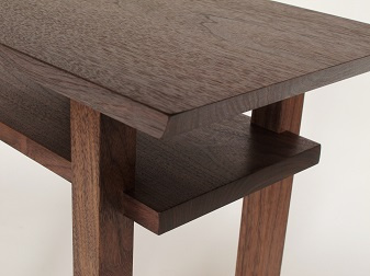 Hand-cut joinery of the inset shelf on these wooden end tables