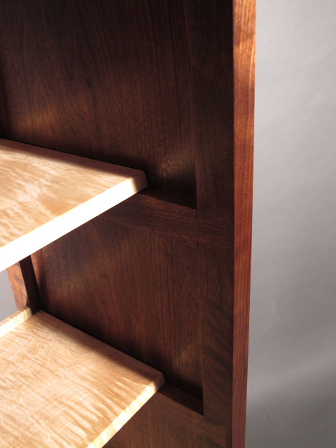 open shelving with dovetail accent