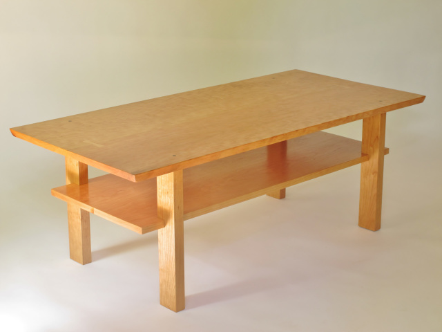 cherry coffee table- a narrow coffee table handmade in the USA from solid wood- furniture for small spaces with a nod to mid century modern furniture styling- coffee table with shelf