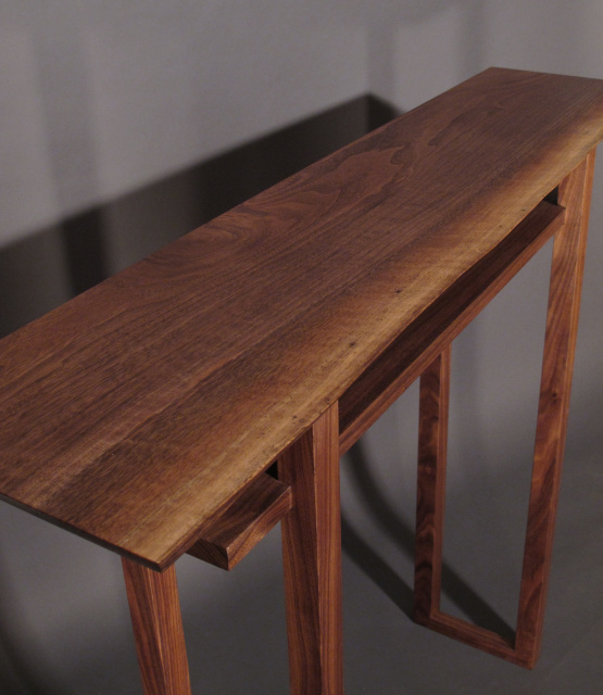 A narrow hall table with live edge table top- walnut wood furniture handmade in the USA by Mokuzai Furniture with mid century modern furniture styling