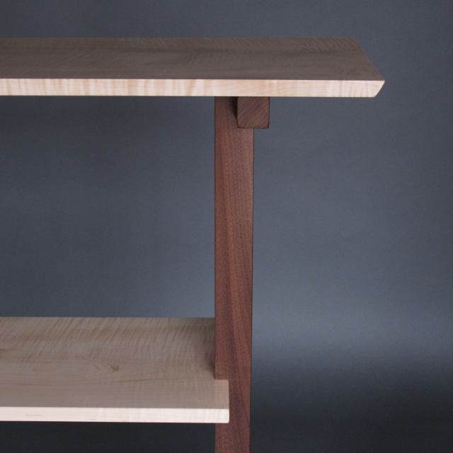 A console table with shelf for a minimalist entertainment center, media console or side table