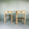 pair of nightstands with drawers and shelves by Mokuzai Furniture